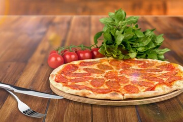 Tasty hot vegetable pizza with pepper and tomatoes