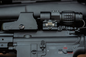 Close-up parts of automatic weapon with selective focus and blurred background