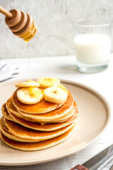 cooked pancake on plate at wooden background