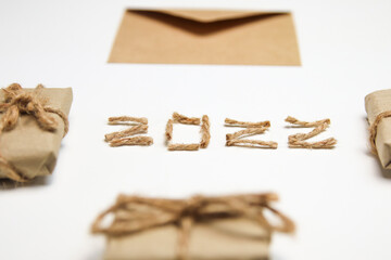 Happy New year 2022. New Year Concept welcoming New Year 2022 written by craft rope or jute on...