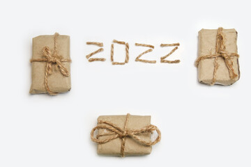 Brown eco gift boxes. Number 2022. Happy New year 2022. New Year Concept welcoming New Year 2022...