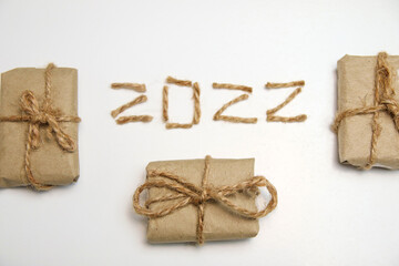 Brown eco gift boxes. Number 2022. Happy New year 2022. New Year Concept welcoming New Year 2022...