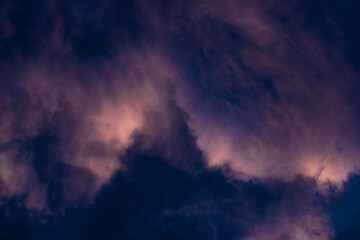Storm clouds night sky in purples