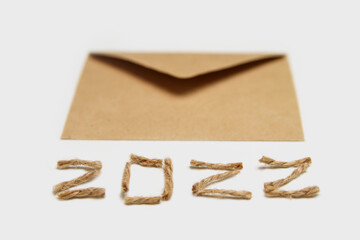 Happy New year 2022. New Year Concept welcoming New Year 2022 written by craft rope or jute on...