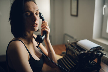 Lonely woman making a phone call at home closeup.
