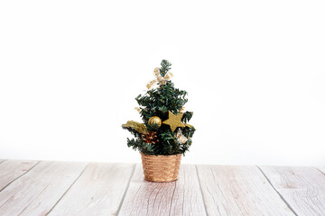 Cute little Christmas tree on wooden table