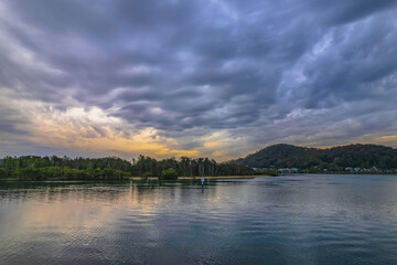 Cloud covered aerial sunrise waterscape