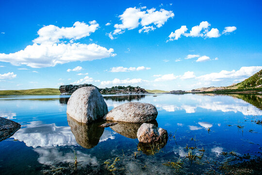 Blue lake idill under cloudline sky