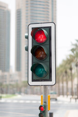 Closeup of red traffic stoplight in the city. 