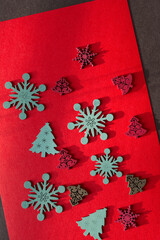 retro christmas wooden decorations on paper - photographed with descriptive, raking or low light