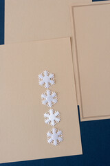 white fabric snowflakes on old stationary with space