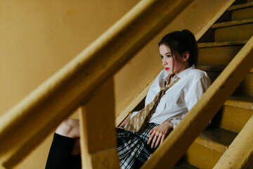 woman sitting on the stairs in country style