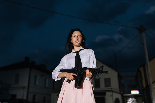 A Young Woman Holding a Gun