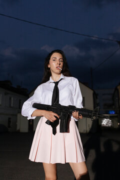 Woman with an assault rifle in her hands