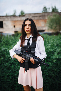 Woman Guards a crop while holding a gun