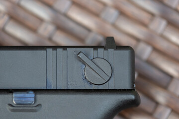 Close-up parts of automatic weapon with selective focus and blurred background