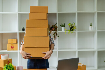 start a business sme Asian woman holding parcel boxes and service concept for delivery