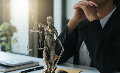 Fototapeta Judge gavel with Justice lawyers, Businesswoman in suit or lawyer working on a documents. Legal law, advice and justice concept. obraz