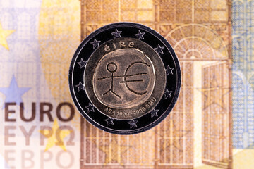 Fototapeta na wymiar 2 euro coin and a fragment of a 200 euro note close-up