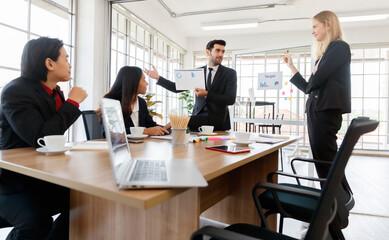 Group of diverse colleagues brainstorming in boardroom