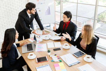 Group of diverse colleagues brainstorming in boardroom