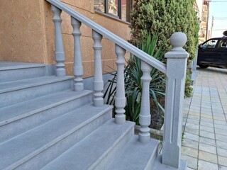 gray concrete staircase steps railing side view close up
