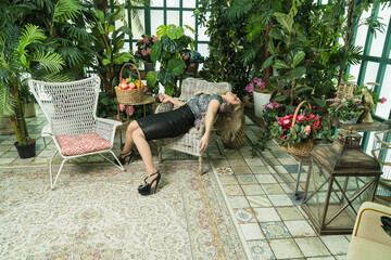 Strangled beautiful woman in a greenhouse. Simulation of the crime scene.....