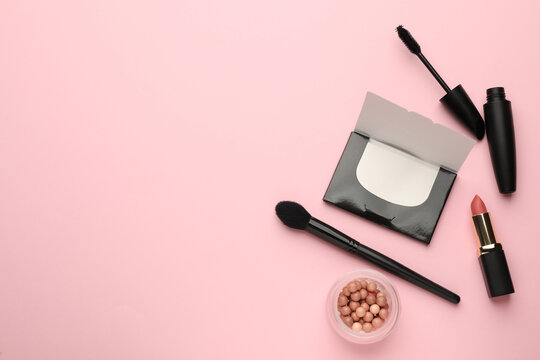 Flat Lay Composition With Facial Oil Blotting Tissues And Makeup Products On Pink Background, Space For Text. Mattifying Wipes