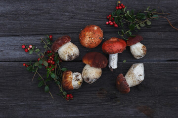 forest gifts, mushrooms and berries on a wooden table