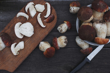 cooking and cutting mushrooms on a wooden table