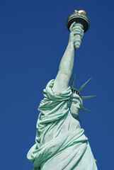 Fototapeta na wymiar Statue of Liberty viewed close up from below
