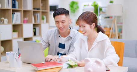 couple discuss finances at home