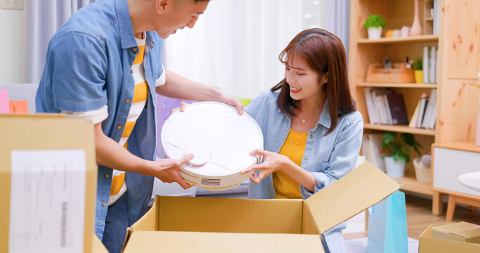 couple open delivery boxes