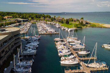 Aerial view of Traverse city marina in Michigan with several boats docked - Powered by Adobe