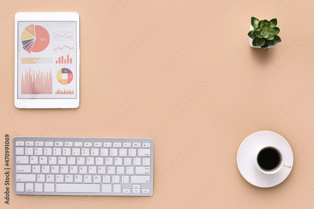 Fototapete tablet computer with charts, cup of coffee and computer keyboard on beige background