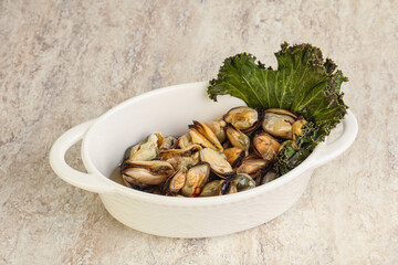 Tasty marinated mussels in the bowl