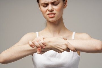 disgruntled woman rheumatism arm pain health problems isolated background