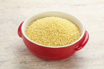 Raw couscous in the bowl