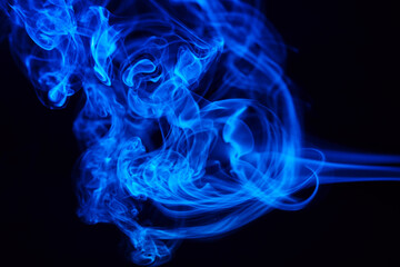 Abstract colored smoke hookah on dark background. Texture. Art Design element. Personal vaporizers...