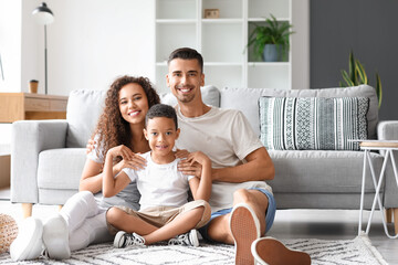 Happy interracial family at home - Powered by Adobe