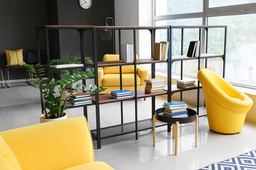 Interior of stylish living room with modern bookshelf © Pixel-Shot
