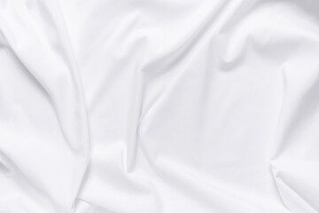 Abstract white fabric texture background. Cloth soft wave. Creases of satin, silk, and cotton.