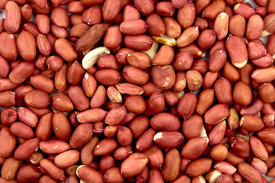Peeled raw peanuts food background