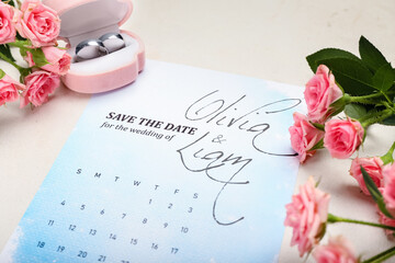 Beautiful composition with wedding calendar on table