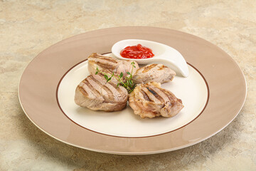 Grilled pork tenderlion with tomato sauce