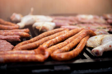 grilled meat on the grill.
Sausages isolated on barbecue grill