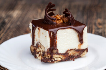 chocolate cream cake covered with milk chocolate