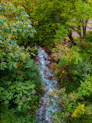 River of sulfur springs flowing through a hot spring town (Zao, Yamagata, Japan)