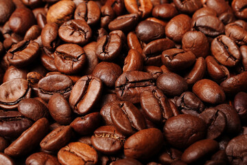 Closeup macro a group roasted brown or black coffee grains background