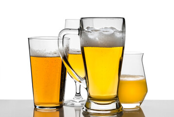 Different glasses with beer on white isolate background